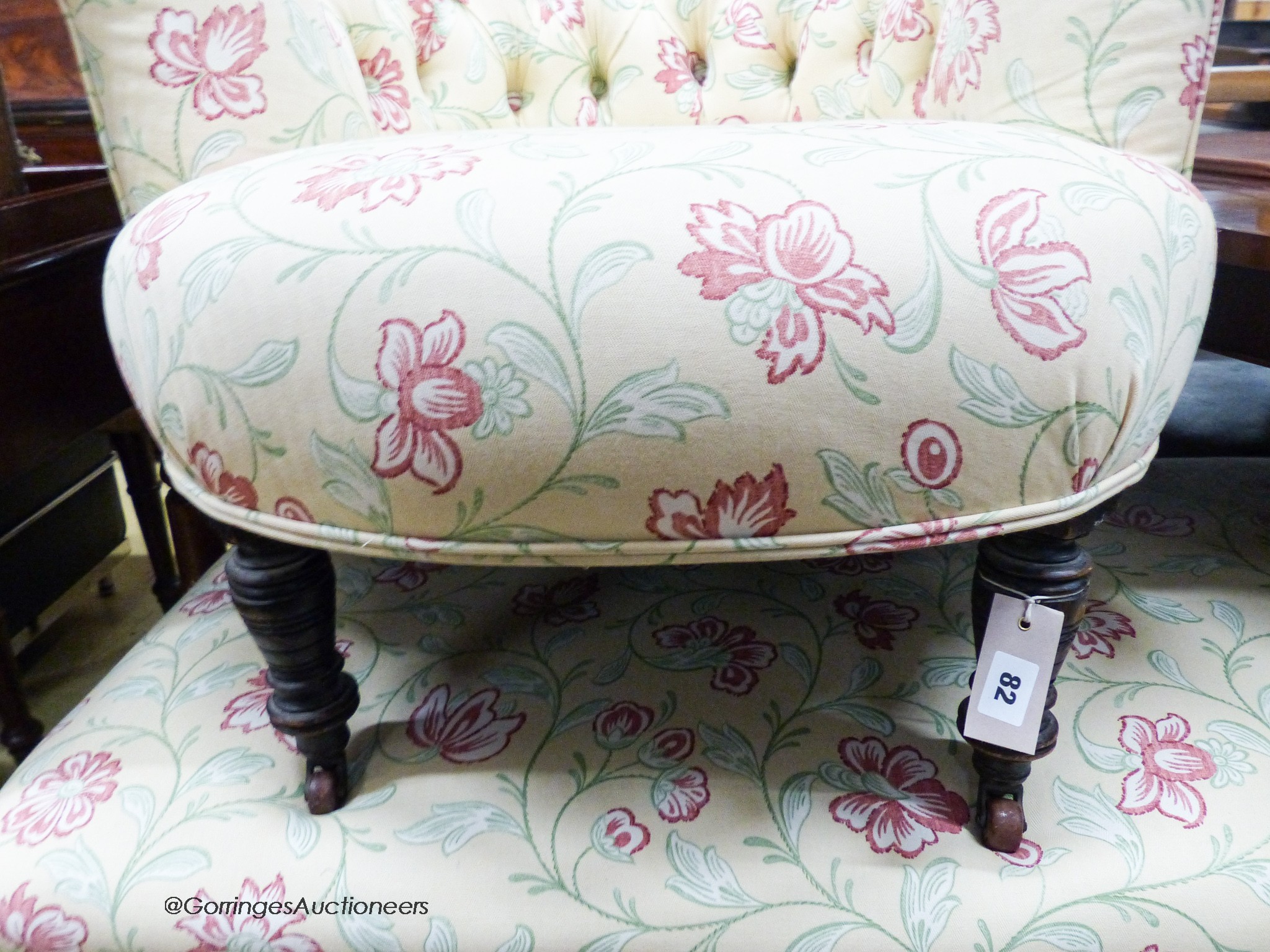 A late Victorian upholstered ottoman, length 112cm, depth 58cm, height 48cm together with a buttoned framed tub chair upholstered in the same fabric